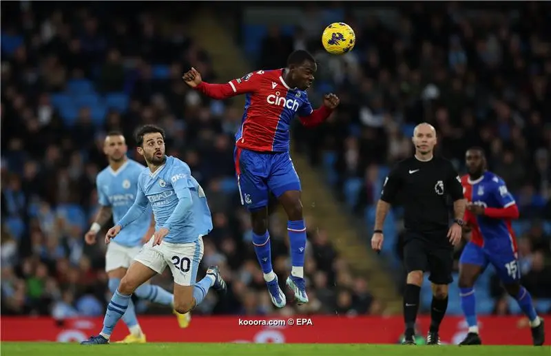 Late penalty rocks Man City as Palace hold champions