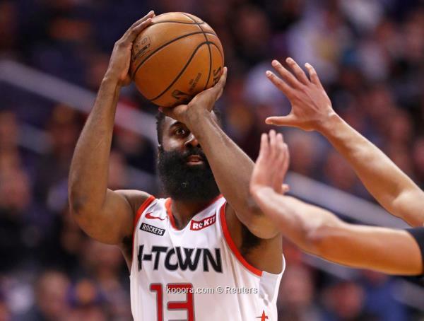 Dec 21, 2019; Phoenix, Arizona, USA; Houston Rockets guard James Harden (13) shoots a three pointer against the Phoenix Suns in the second half at Talking Stick Resort Arena.